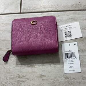 Coach Magenta Women's Wallet..cross grain leather
Zip around